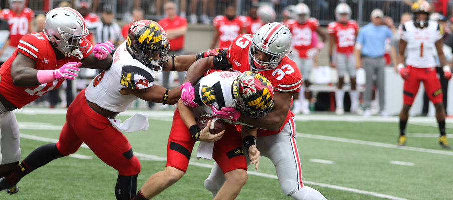 Dante Booker sacked Maryland quarterback Max Bortenschlager on Ohio State's first defensive play of Saturday's game 