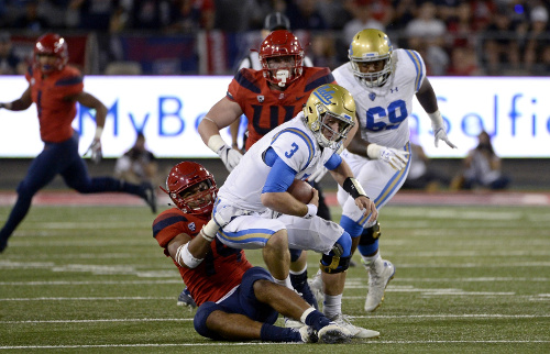 Oct 14, 2017; Tucson, AZ, USA; UCLA Bruins quarterback Josh Rosen (3) is tackled by Arizona Wildcats defensive end Kylan Wilborn (14) during the second half at Arizona Stadium. Mandatory Credit: Casey Sapio-USA TODAY Sports Oct 14, 2017; Tucson, AZ, USA; UCLA Bruins quarterback Josh Rosen (3) is tackled by Arizona Wildcats defensive end Kylan Wilborn (14) during the second half at Arizona Stadium. Mandatory Credit: Casey Sapio-USA TODAY Sports
