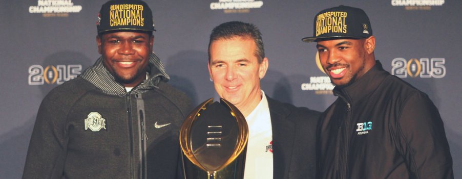 Father (right), son (left) and the Holy Ghost (middle) pose with the trophy Ohio State would love to have a chance at this season.