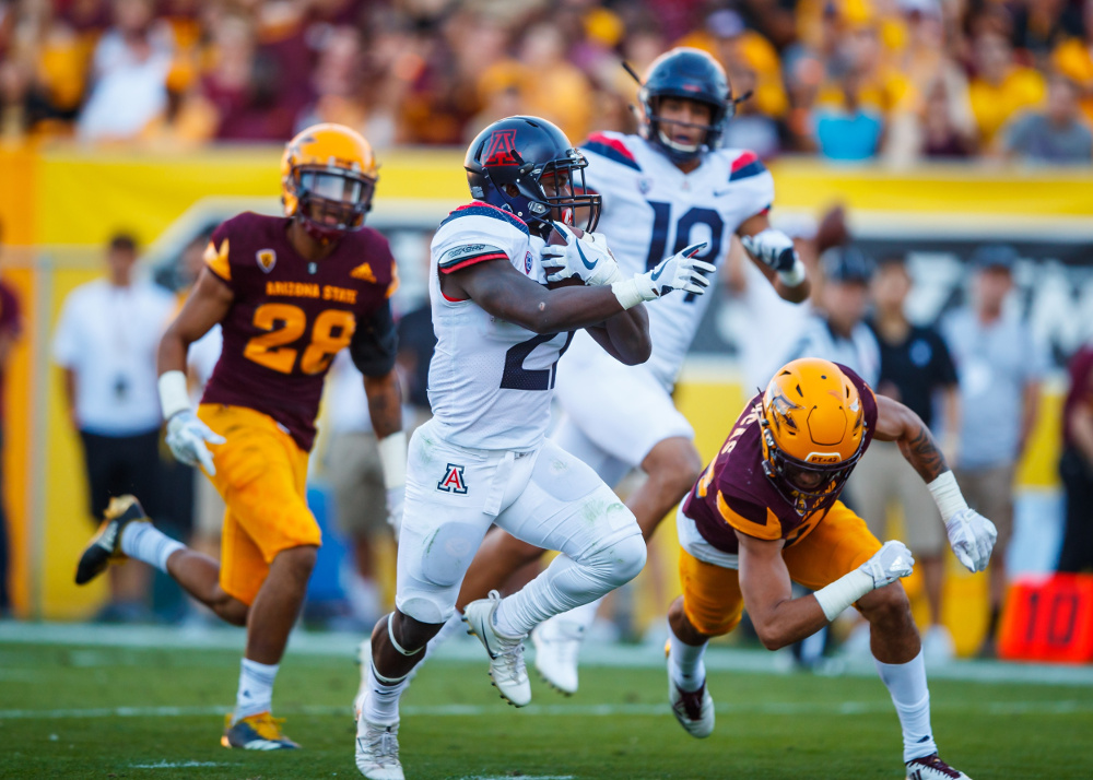 Nov 25, 2017; Tempe, AZ, USA; Arizona Wildcats running back J.J. Taylor (21) runs for a second quarter touchdown against the Arizona State Sun Devils during the Territorial Cup at Sun Devil Stadium. Mandatory Credit: Mark J. Rebilas-USA TODAY Sports