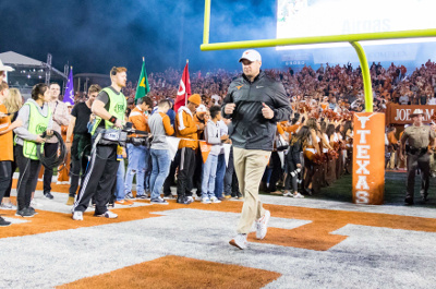 Nov 24, 2017; Austin, TX, USA; Texas Longhorns head coach Tom Herman runs out of the tunnel joining his players before the game against the Texas Tech Red Raiders at Darrell K Royal-Texas Memorial Stadium. Mandatory Credit: John Gutierrez-USA TODAY Sports