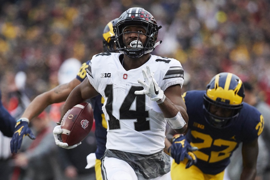 Nov 25, 2017; Ann Arbor, MI, USA; Ohio State Buckeyes wide receiver K.J. Hill (14) runs the ball chased by Michigan Wolverines defensive back David Long (22) in the second half at Michigan Stadium. Mandatory Credit: Rick Osentoski-USA TODAY Sports