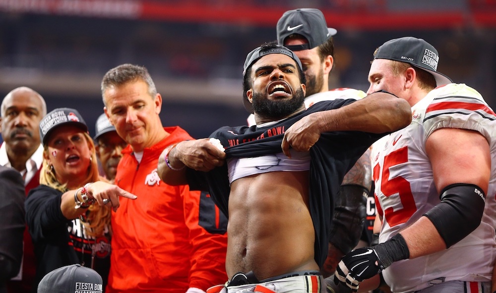 Jan 1, 2016; Glendale, AZ, USA; Ohio State Buckeyes running back Ezekiel Elliott celebrates by lifting his shirt to show his muscles following the game against the Notre Dame Fighting Irish during the 2016 Fiesta Bowl at University of Phoenix Stadium. The Buckeyes defeated the Fighting Irish 44-28. Mandatory Credit: Mark J. Rebilas-USA TODAY Sports