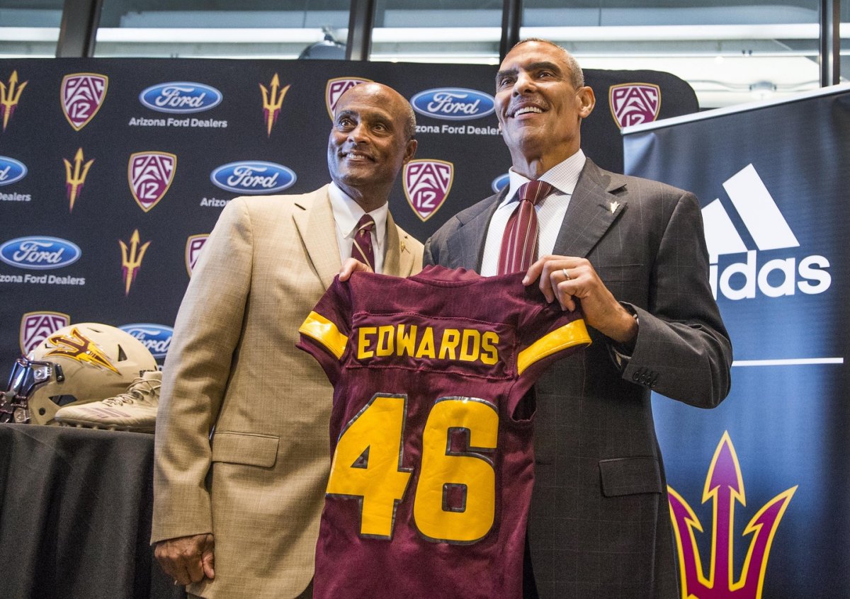 Dec 4, 2017; Tempe, AZ, USA; Arizona State Sun Devils vice president of athletics Ray Anderson, left, introduces the new head football coach Herman Edwards at Sun Devil Stadium. Mandatory Credit: Tom Tingle/The Arizona Republic via USA TODAY Sports