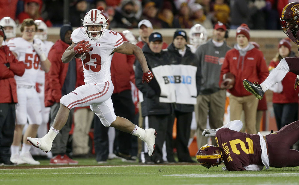 Nov 25, 2017; Minneapolis, MN, USA; Wisconsin Badgers running back Jonathan Taylor (23) scores a long touchdown during the fourth quarter of the Badgers 31-0 win over the Minnesota Golden Gophers at TCF Bank Stadium. Mike De Sisti/Milwaukee Journal Sentinel via USA TODAY NETWORK Nov 25, 2017; Minneapolis, MN, USA; Wisconsin Badgers running back Jonathan Taylor (23) scores a long touchdown during the fourth quarter of the Badgers 31-0 win over the Minnesota Golden Gophers at TCF Bank Stadium. Mike De Sisti/Milwaukee Journal Sentinel via USA TODAY NETWORK