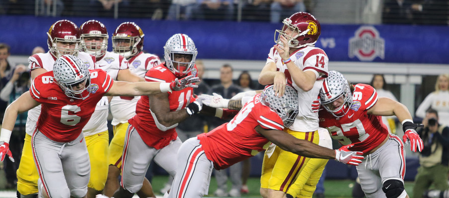 Sam Hubbard, Jalyn Holmes, Tyquan Lewis and Nick Bosa get after USC quarterback Sam Darnold