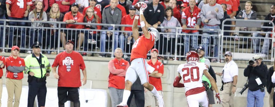 Austin Mack high-points the football against Oklahoma. 