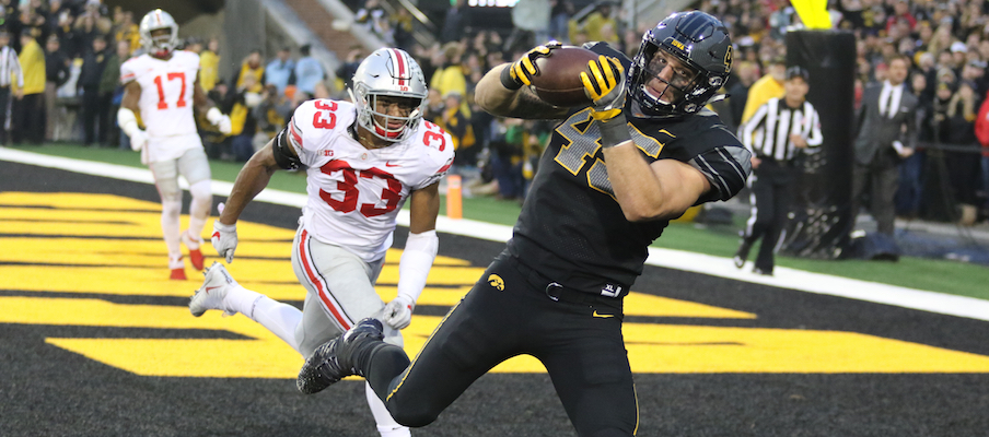 Dante Booker gives up a touchdown catch to Iowa's Drake Kulick.