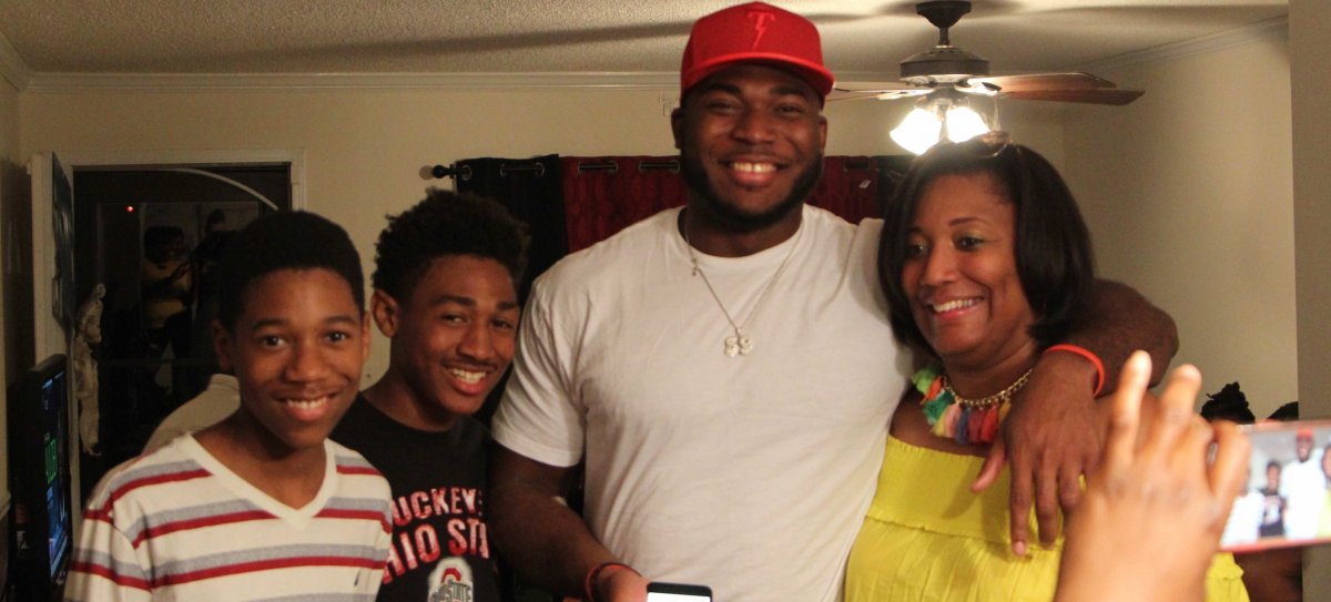 Tyquan Lewis celebrates his selection with loved ones.