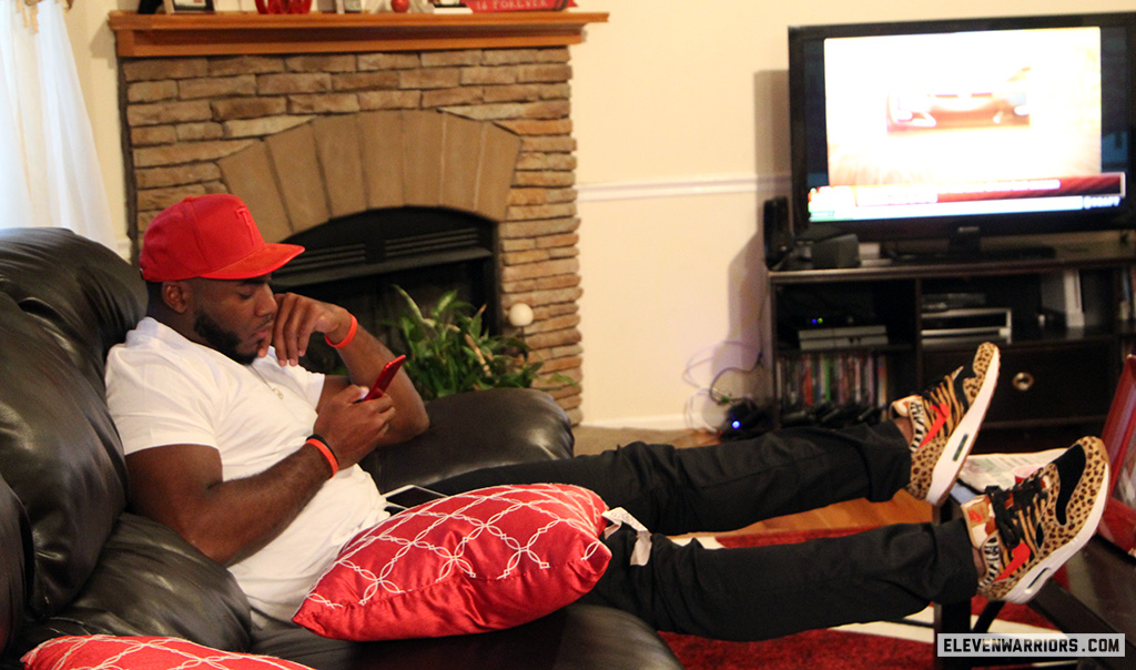 Tyquan Lewis on his family's couch as he waits for his name to be called in the NFL Draft