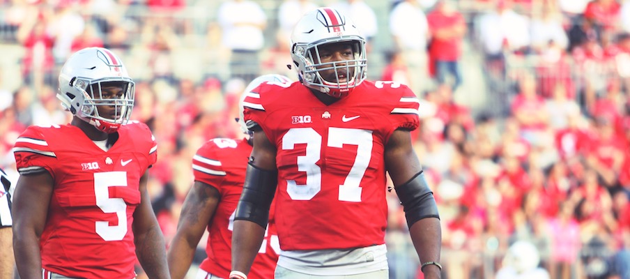 Raekwon McMillan (5) and Joshua Perry (37)