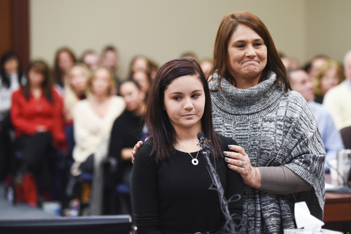 Jan. 24, 2018; Lansing, MI, USA; With her coach at her side, gymnast Kaylee Lorincz prepares to make her statement during the final day of victim impact statements in Ingham County Circuit Court. Mandatory Credit: Matthew Dae Smith/Lansing State Journal via USA TODAY NETWORK