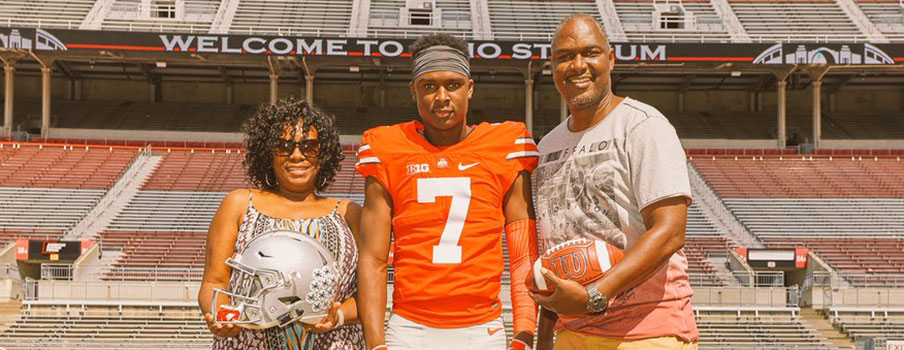 Jordan Battle and his parents