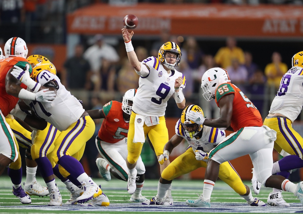 Sep 2, 2018; Arlington, TX, USA; LSU Tigers quarterback Joe Burrow (9) throws in the pocket against the Miami Hurricanes at AT&T Stadium. Mandatory Credit: Matthew Emmons-USA TODAY Sports