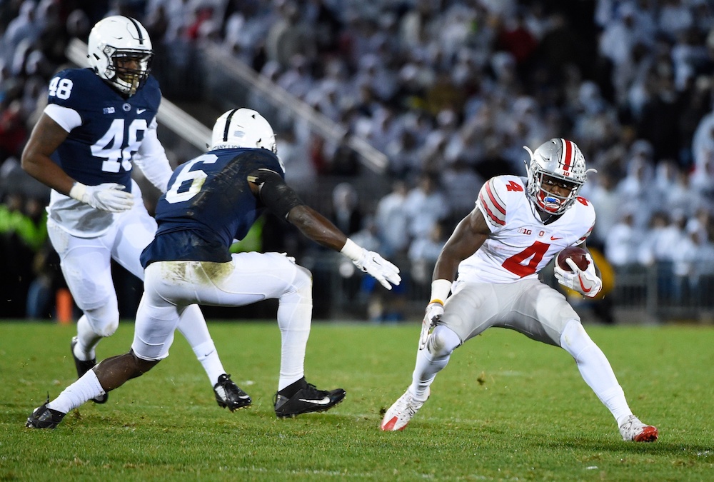 Oct 22, 2016; University Park, PA, USA; Ohio State Buckeyes running back Curtis Samuel (4) runs with the ball as Penn State Nittany Lions safety Malik Golden (6) and defensive end Sharif Miller (48) defend during the fourth quarter at Beaver Stadium. Penn State defeated Ohio State 24-21. Mandatory Credit: Rich Barnes-USA TODAY Sports