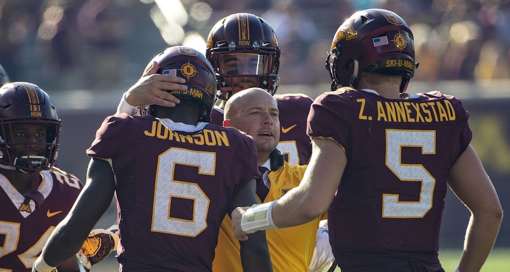 Sep 15, 2018; Minneapolis, MN, USA; Minnesota Golden Gophers head coach P.J. Fleck smiles with wide receiver Tyler Johnson (6) and quarterback Zack Annexstad (5) after a touchdown in the second half against the Miami (Oh) Redhawks at TCF Bank Stadium. Mandatory Credit: Jesse Johnson-USA TODAY Sports