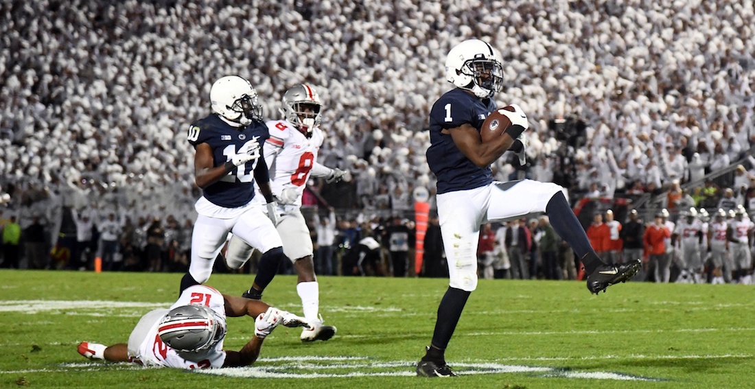 Sep 29, 2018; University Park, PA, USA; Penn State Nittany Lions wide receiver KJ Hamler (1) runs after the catch for a touchdown as Ohio State Buckeyes safety Isaiah Pryor (12) defends in the second quarter at Beaver Stadium. Mandatory Credit: James Lang-USA TODAY Sports