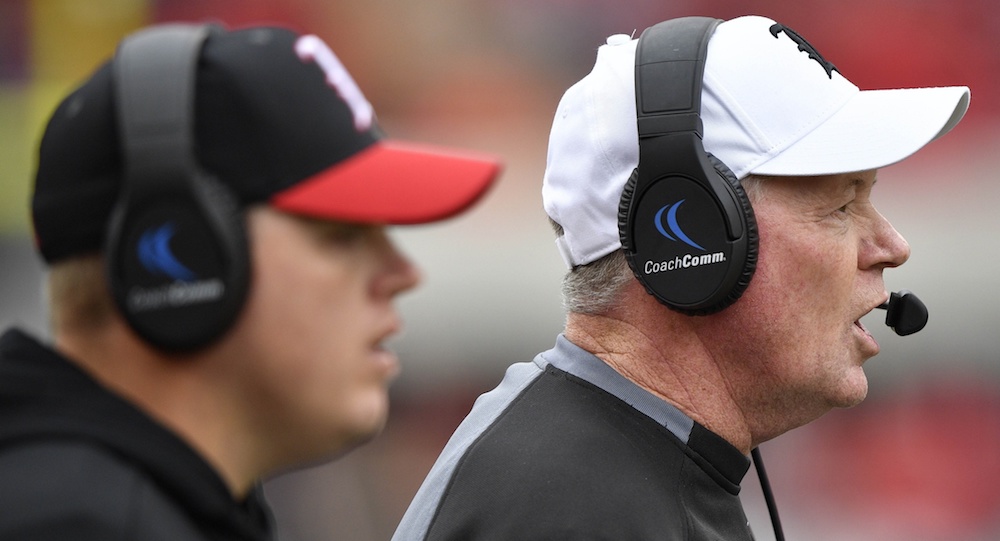 Oct 27, 2018; Louisville, KY, USA; Louisville Cardinals head coach Bobby Petrino calls out instructions alongside his son and quarterbacks coach Nick Petrino during the second half against the Wake Forest Demon Deacons at Cardinal Stadium. Wake Forest defeated Louisville 56-35. Mandatory Credit: Jamie Rhodes-USA TODAY Sports