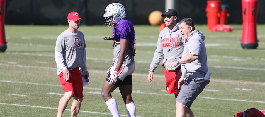 Alex Grinch and Greg Schiano celebrate with Josh Proctor