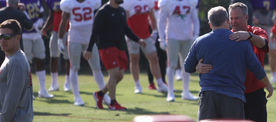 Chip Kelly hugs Bill Davis during Ohio State's practice