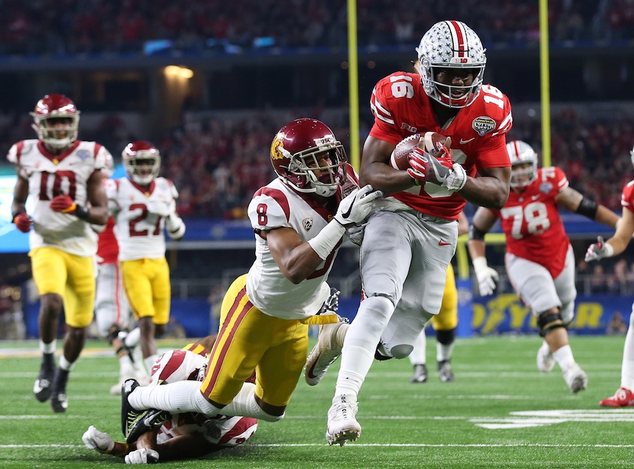 Dec 29, 2017; Arlington, TX, USA; Ohio State Buckeyes quarterback J.T. Barrett (16)runs for a touchdown in the second quarter against Southern California Trojans cornerback Iman Marshall (8) in the 2017 Cotton Bowl at AT&T Stadium. Mandatory Credit: Matthew Emmons-USA TODAY Sports