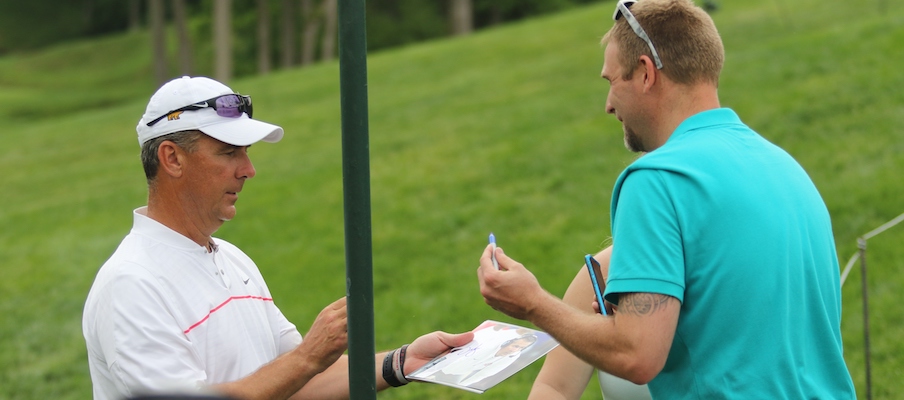 Urban Meyer signing an autograph