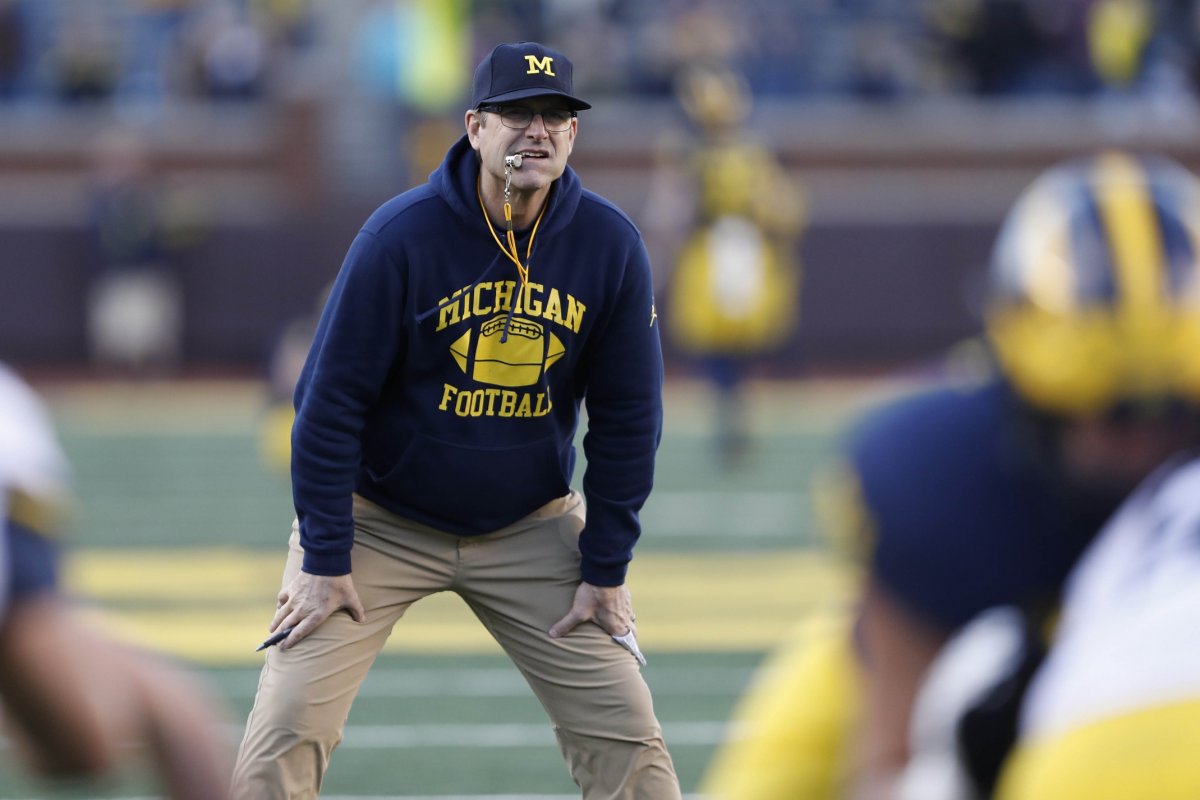 Apr 13, 2019; Ann Arbor, MI, USA; Michigan Wolverines head coach Jim Harbaugh watches his team with a whistle in his mouth during the spring football game at Michigan Stadium. Mandatory Credit: Raj Mehta-USA TODAY Sports