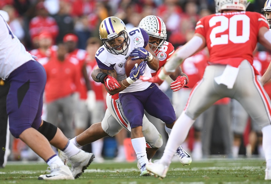 Jan 1, 2019; Pasadena, CA, USA; Ohio State Buckeyes defensive tackle Dre'Mont Jones (86) tackles Washington Huskies running back Myles Gaskin (9) in the first half in the 2019 Rose Bowl at Rose Bowl Stadium. Mandatory Credit: Gary A. Vasquez-USA TODAY Sports