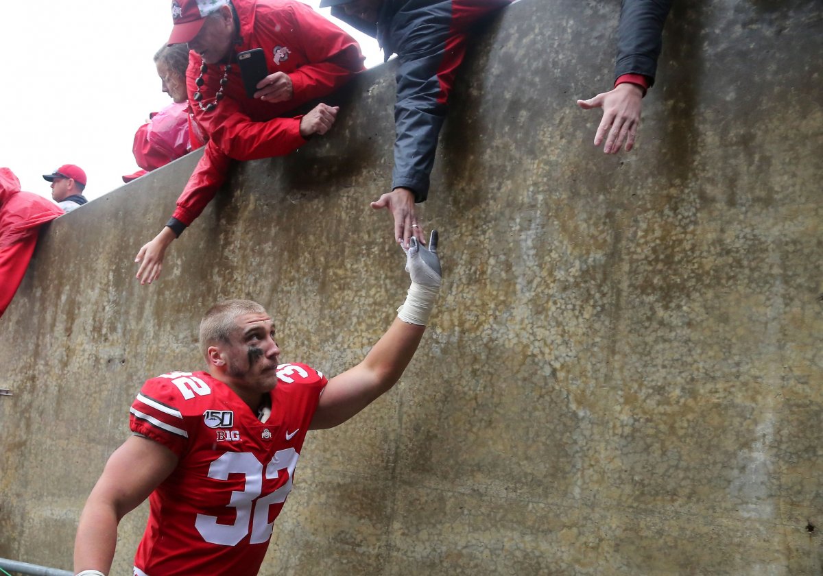 Oct 26, 2019; Columbus, OH, USA; Ohio State Buckeyes linebacker Tuf Borland (32) celebrates with fans after the game against the Wisconsin Badgers at Ohio Stadium. Mandatory Credit: Joe Maiorana-USA TODAY Sports