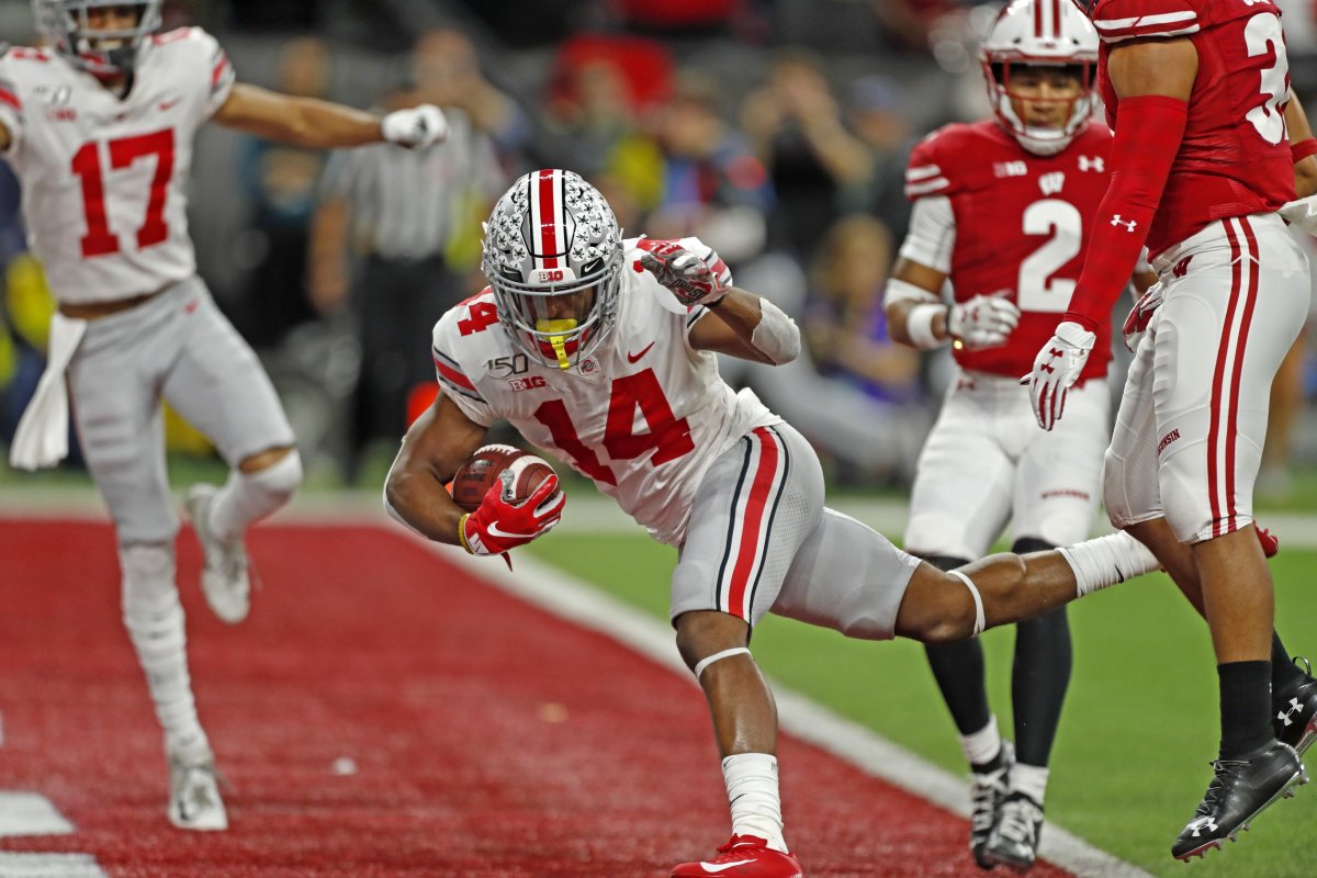 Dec 7, 2019; Indianapolis, IN, USA; Ohio State Buckeyes wide receiver K.J. Hill Jr. (14) scores a touchdown against the Wisconsin Badgers during the third quarter in the 2019 Big Ten Championship Game at Lucas Oil Stadium. Mandatory Credit: Brian Spurlock-USA TODAY Sports