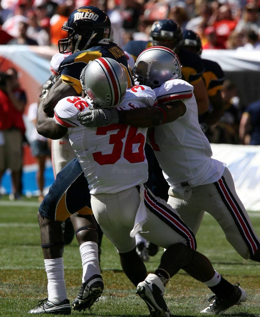 Rolle makes a tackle against Toledo. Rolle makes a tackle against Toledo.