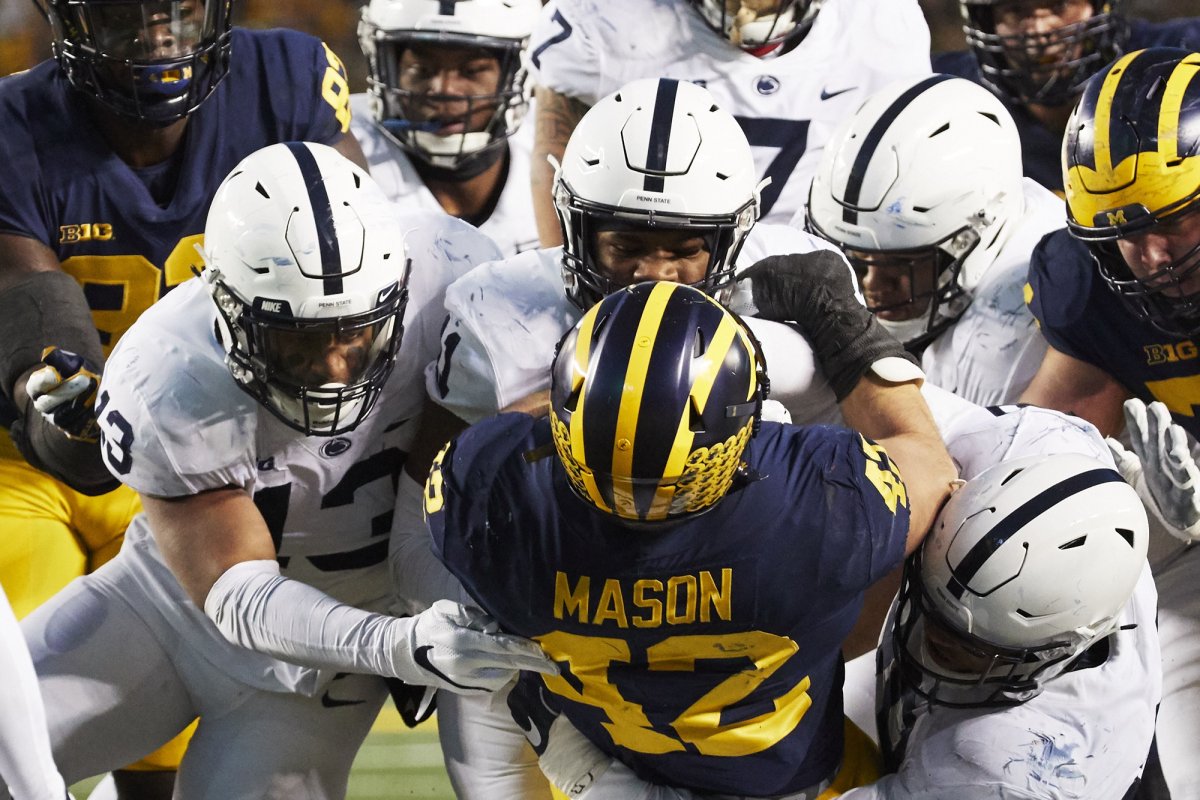 Nov 3, 2018; Ann Arbor, MI, USA; Michigan Wolverines fullback Ben Mason (42) is tackled by Penn State Nittany Lions defense in the second half at Michigan Stadium. Mandatory Credit: Rick Osentoski-USA TODAY Sports