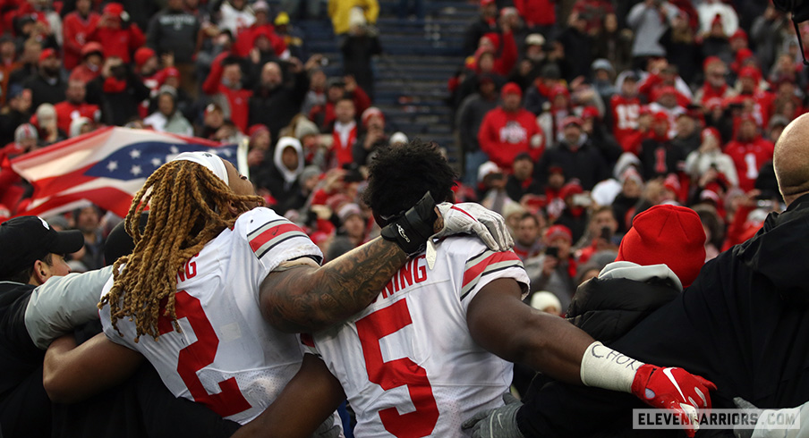 Chase Young and Baron Browning celebrate an Ohio State win in Ann Arbor.