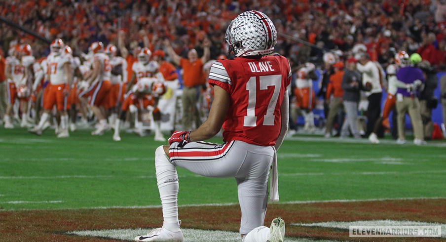 Chris Olave sits dejected in the end zone following Clemson's Fiesta Bowl win over Ohio State.