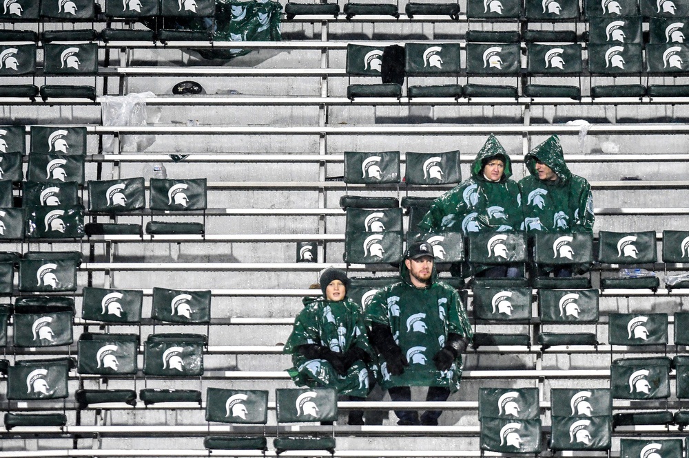 Michigan State fans sit among empty seats during the fourth quarter on Saturday, Oct. 26, 2019, at Spartan Stadium in East Lansing.