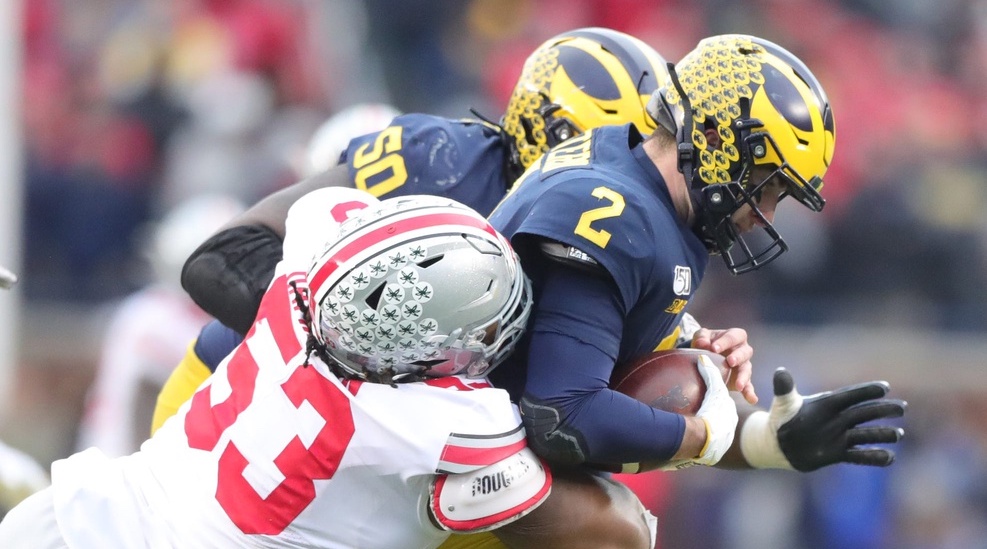 Michigan Wolverines quarterback Shea Patterson is sacked by Ohio State Buckeyes defensive tackle Davon Hamilton during the second half at Michigan Stadium in Ann Arbor, Saturday, Nov. 30, 2019. Sad Michigan football