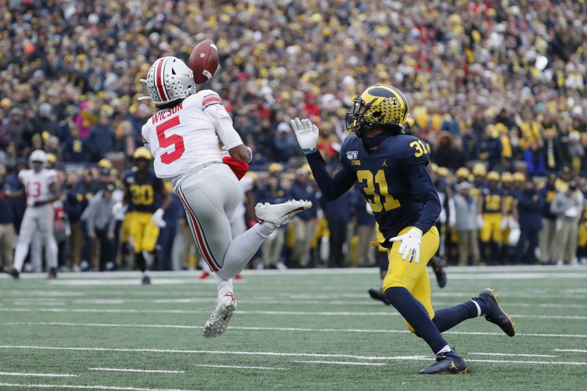 Nov 30, 2019; Ann Arbor, MI, USA; Ohio State Buckeyes wide receiver Garrett Wilson (5) makes a reception on Michigan Wolverines defensive back Vincent Gray (31) in the first half at Michigan Stadium. Mandatory Credit: Rick Osentoski-USA TODAY Sports