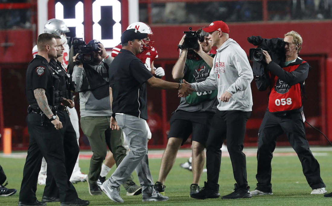 Sep 28, 2019; Lincoln, NE, USA; Ohio State Buckeyes head coach Ryan Day and Nebraska Cornhuskers head coach Scott Frost meet at midfield after the game at Memorial Stadium. Mandatory Credit: Bruce Thorson-USA TODAY Sports