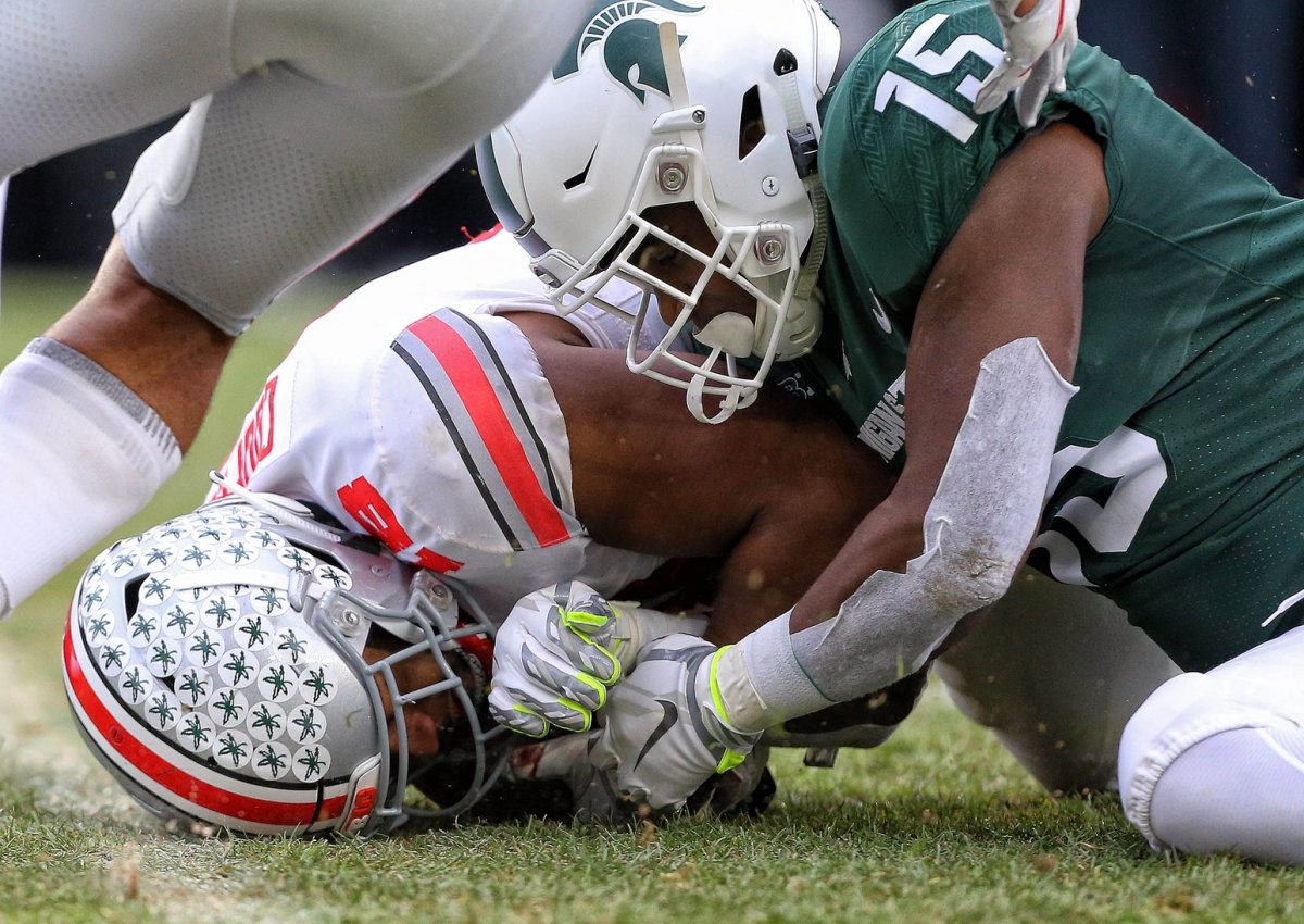 Nov 10, 2018; East Lansing, MI, USA; Ohio State Buckeyes defensive end Jonathon Cooper (18) recovers a fumble of Michigan State Spartans running back La'Darius Jefferson (15) during the second half of a game at Spartan Stadium. Mandatory Credit: Mike Carter-USA TODAY Sports