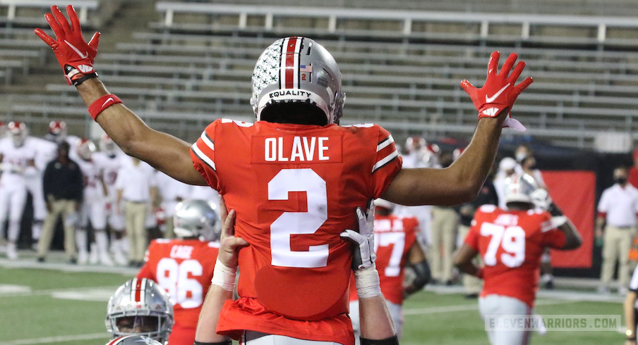 Chris Olave celebrates his touchdown