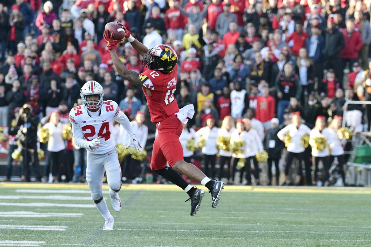 Nov 17, 2018; College Park, MD, USA; Maryland Terrapins wide receiver Taivon Jacobs (12) catches a pass from Ohio State Buckeyes cornerback Shaun Wade (24) during the fourth quarter at Capital One Field at Maryland Stadium. Mandatory Credit: Tommy Gilligan-USA TODAY Sports