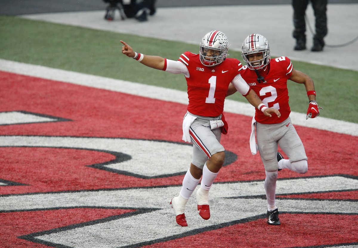 Nov 21, 2020; Columbus, Ohio, USA; Ohio State Buckeyes quarterback Justin Fields (1) celebrates his touchdown run with wide receiver Chris Olave (2) during the second quarter against the Indiana Hoosiers at Ohio Stadium. Mandatory Credit: Joseph Maiorana-USA TODAY Sports