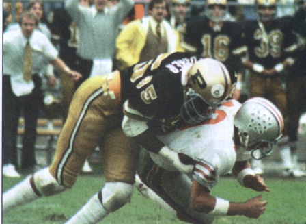 Purdue linebacker Keena Turner sacks Ohio State quarterback Art Schlichter in the Boilermakers' 1978 victory over the Buckeyes. Turner believes this victory paved the way to the Peach Bowl bid that season.