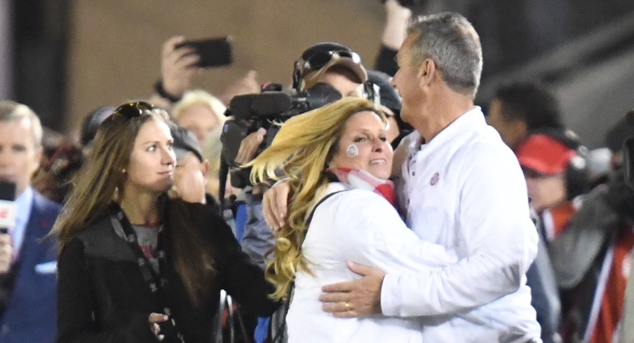 Jan 1, 2019; Pasadena, CA, USA; Ohio State Buckeyes head coach Urban Meyer celebrates with his wife Shelley Mayer Meyer after the Ohio State Buckeyes defeated the Washington Huskies in the 2019 Rose Bowl at Rose Bowl Stadium. Mandatory Credit: Gary A. Vasquez-USA TODAY Sports