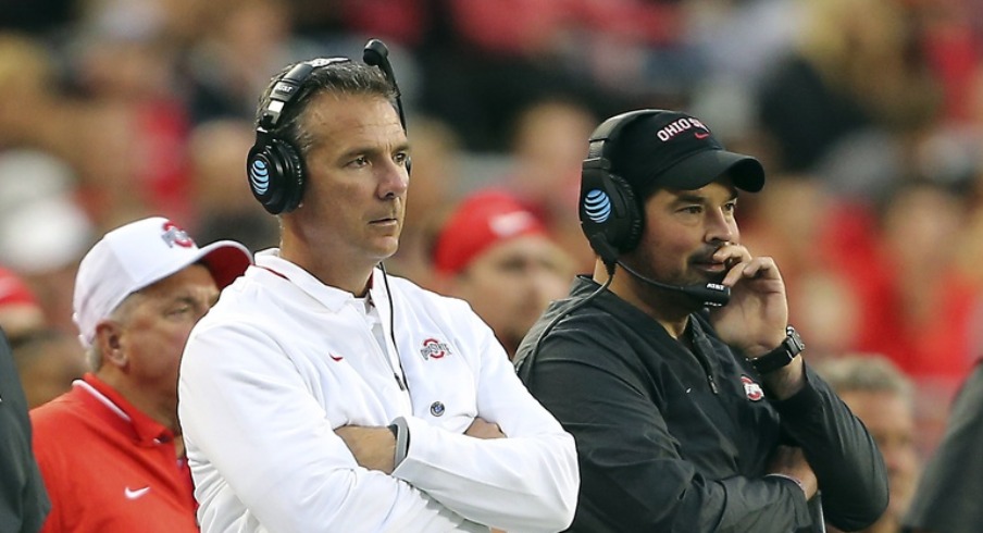 Sep 22, 2018; Columbus, OH, USA; Ohio State Buckeyes head coach Urban Meyer (center) watches the game from the sidelines with assistant coach Ryan Day (right) and assistant coach Tony Alford (left) during the third quarter against the Ohio State Buckeyes at Ohio Stadium. Mandatory Credit: Joe Maiorana-USA TODAY Sports