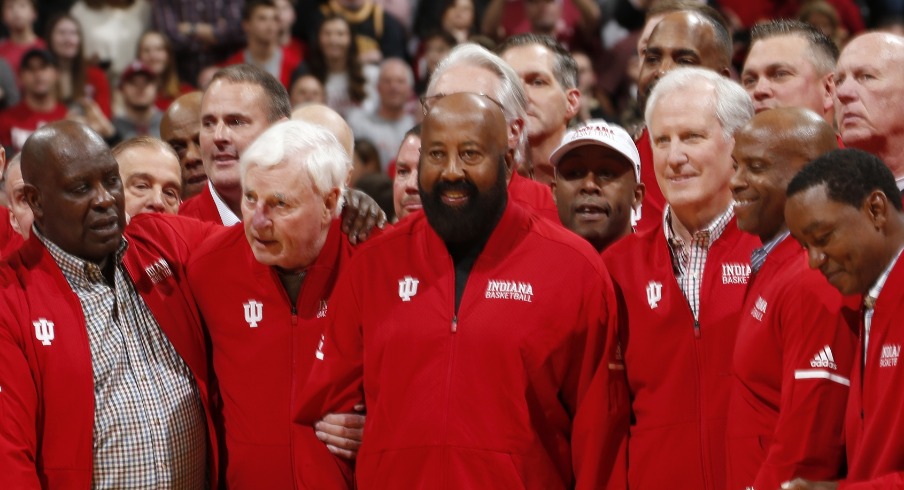 Feb 8, 2020; Bloomington, Indiana, USA; Indiana Hoosiers legendary coach Bob Knight stands between Quinn Buckner and Mike Woodson during a halftime tribute to former IU players and Coach Knight at halftime of the game against the Purdue Boilermakers at Simon Skjodt Assembly Hall. Mandatory Credit: Brian Spurlock-USA TODAY Sports