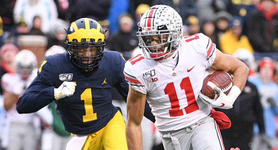 Nov 30, 2019; Ann Arbor, MI, USA; Ohio State Buckeyes wide receiver Austin Mack (11) runs for a touchdown after a completed pass during the fourth quarter against the Michigan Wolverines at Michigan Stadium. Mandatory Credit: Tim Fuller-USA TODAY Sports Nov 30, 2019; Ann Arbor, MI, USA; Ohio State Buckeyes wide receiver Austin Mack (11) runs for a touchdown after a completed pass during the fourth quarter against the Michigan Wolverines at Michigan Stadium. Mandatory Credit: Tim Fuller-USA TODAY Sports