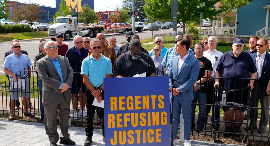 Former Michigan RB Jon Vaughn addresses the media near Michigan Stadium on Wednesday, June 16, 2021. Vaughn was one of several alleged victims of sexual abuse by Dr. Robert Anderson in the 1980s. © Eric Seals/ICS Former Michigan RB Jon Vaughn addresses the media near Michigan Stadium on Wednesday, June 16, 2021. Vaughn was one of several alleged victims of sexual abuse by Dr. Robert Anderson in the 1980s. © Eric Seals/ICS