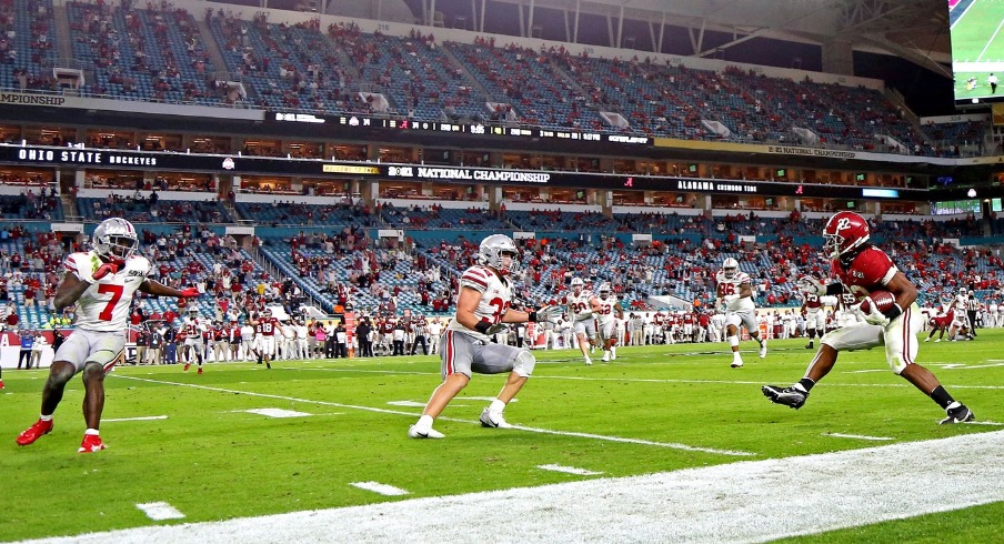 Jan 11, 2021; Miami Gardens, Florida, USA; Alabama Crimson Tide running back Najee Harris (22) runs for a touchdown after a catch during the second quarter Ohio State Buckeyes linebacker Tuf Borland (32) in the 2021 College Football Playoff National Championship Game. Mandatory Credit: Kim Klement-USA TODAY Sports