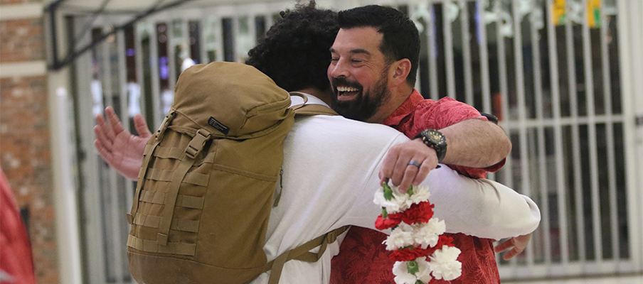 J.T. Tuimoloau and Ryan Day embrace during his arrival in Columbus.